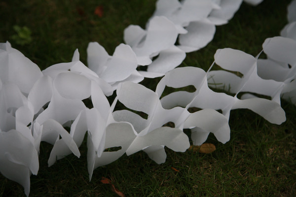 White 4 leaf tissue garland great for birthday party, baby shower, and chirstmas party